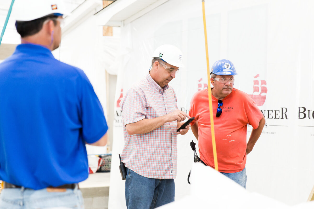 Team members working inside the Buccaneer home building plant in Hamilton Alabama