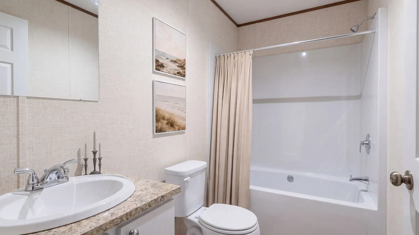 The REDWOOD Guest Bathroom. This Manufactured Mobile Home features 5 bedrooms and 3 baths.