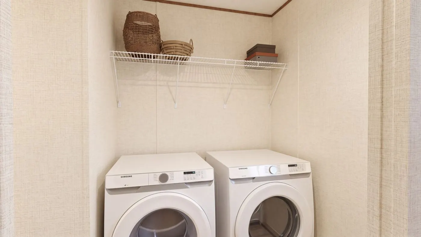 The CEDAR Utility Room. This Manufactured Mobile Home features 3 bedrooms and 2 baths.