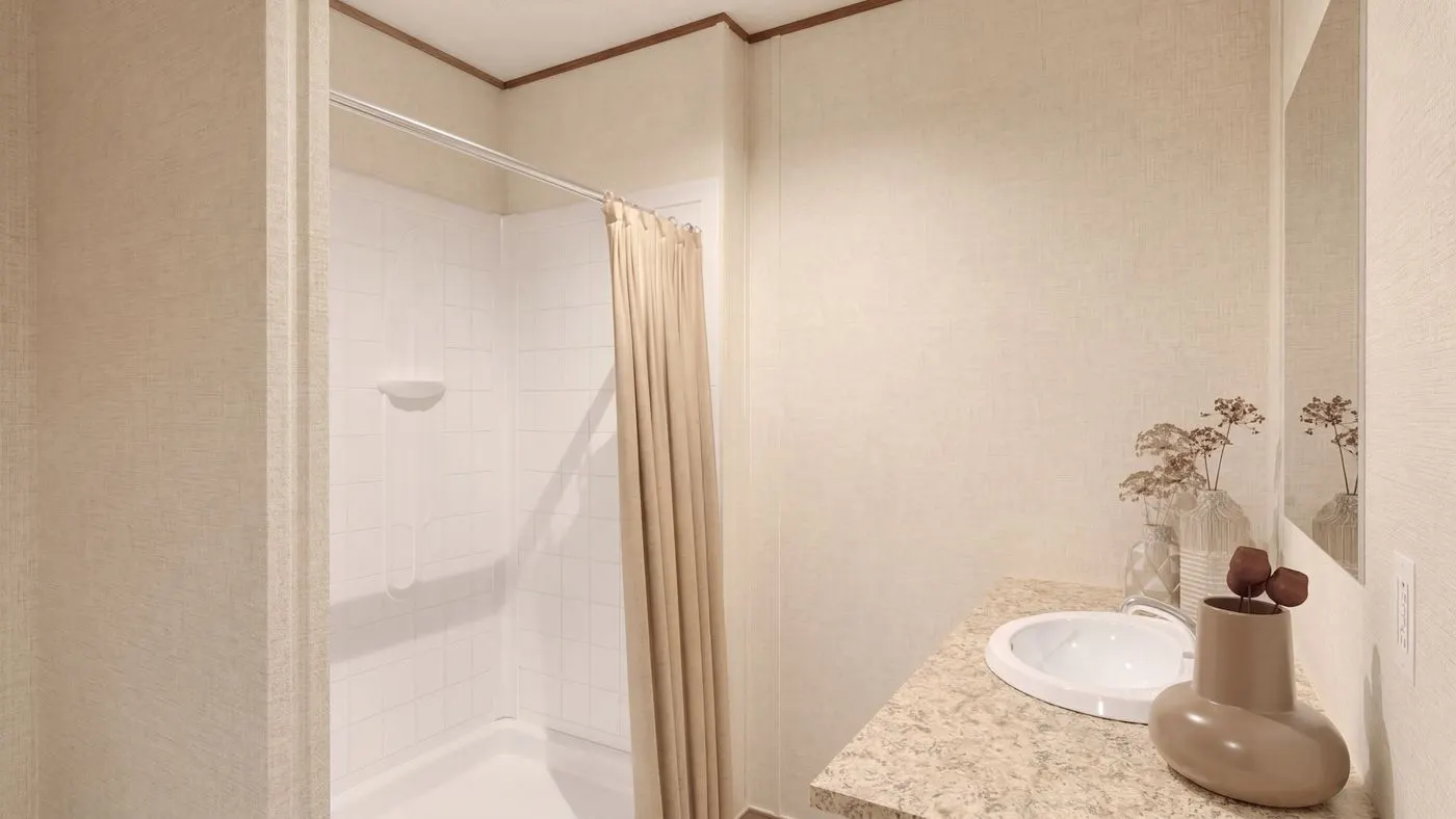 The REDWOOD Primary Bathroom. This Manufactured Mobile Home features 5 bedrooms and 3 baths.