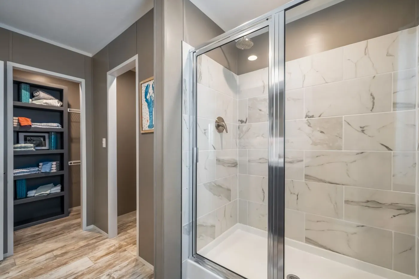 The THE DRIFTWOOD Primary Bathroom. This Manufactured Mobile Home features 3 bedrooms and 2 baths.
