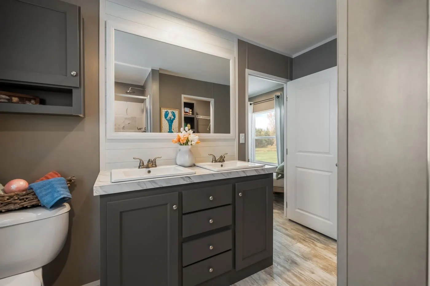 The THE DRIFTWOOD Primary Bathroom. This Manufactured Mobile Home features 3 bedrooms and 2 baths.